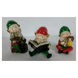 Three ceramic Christmas elves, hand dated 1974,