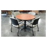 Round conference table with chairs on casters,
