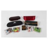 Eyeglass cases, cleaning cloths and a pewter