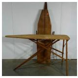 Two early wooden ironing boards, one is missing