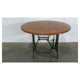 Round table on a Singer sewing table base,