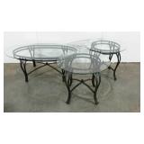 Two glass topped end tables and a coffee table,