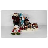 Four Plush snowmen decorations, plus a dancing