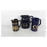 Water pitchers with Crown Royal, 100 Pipers, and