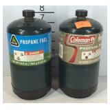 Two partial propane fuels cans, each has a