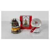 Three snow globes, including Harvey Lewis in box