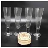Barware, four pilsner glasses with etched ship