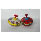 Two Ohio art tin toy spinning tops