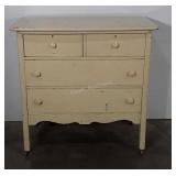 Painted dresser on wheels, top two drawers have