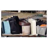 Skid of suitcase, shoe shine box, box fan,