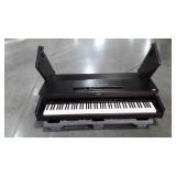 Roland piano, missing cord and stand is damaged,