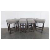Set of four upholstered bar stools, 25"