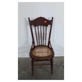 Wooden chair with cane seat