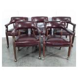 Five faux leather arm chairs on wheels, Seller