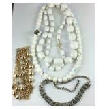 Four costume necklaces