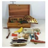 Lane box with trinkets, dice, keychains, handfan,