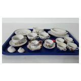 Porcelain tea set pieces, includes cups, saucers,
