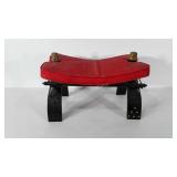Camel saddle stool with red leather cushion,