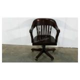 Office chair on casters, dark wood