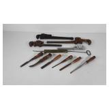 Tools, pipe wrenches, chisels, and brass pump