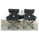 Two folding camp chairs with storage bags