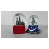 Two Statue of Liberty snowglobes, 7"