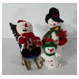 Holiday decor, three stuffed snowman, one on