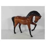 Leather wrapped horse figure, 14" × 17"