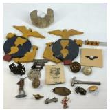 Military related items, pins, wooden cutouts,
