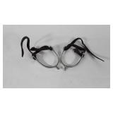 Pair of spurs with leather straps