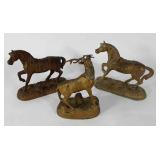 Three metal statues, two horses and stag, age