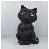 Painted cement raccoon figure, 9" tall