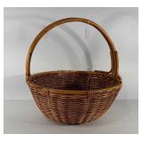 Large basket with handle, rim is loose, 21" × 22"