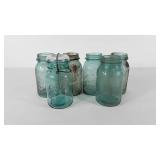 Six Ball quart size canning jars, one with glass