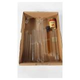 Glass test tubes and denture powder can