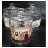 Three glass canisters, all are 7"
