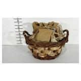 Basket containing burlap bags of various sizes