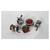 Five fishing reels, includes J.C. Higgins,