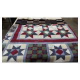 Two quilts, stars 84x90 and suit fabric
