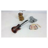 Four lighters, guitar, purse, dog, and cross