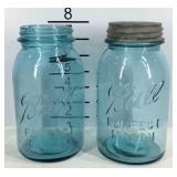 Two mason ball jars, only one has lid