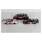 Three Nascar die cast collector cars, #29, #24