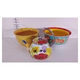 Two Pioneer Woman melamine mixing bowls and a tea