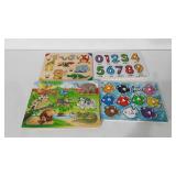 Four Melissa and Doug wooden puzzles