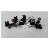 Nine Scottish Terrier figurines, including a