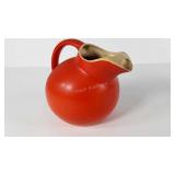 Orange ball pitcher, has small chip on edge and