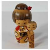Two wooden kokeshi dolls