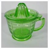 Green glass measuring cup with reamer