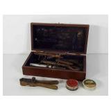Wooden box with gun supplies including bullet