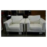 Two white leather-look arm chairs, seller code